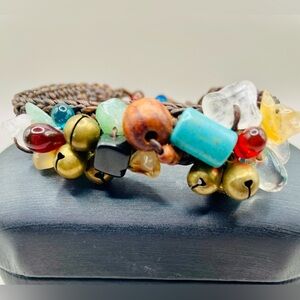 Multi color stone chips on woven leather bracelet. 8 inches long. Chunky. Boho